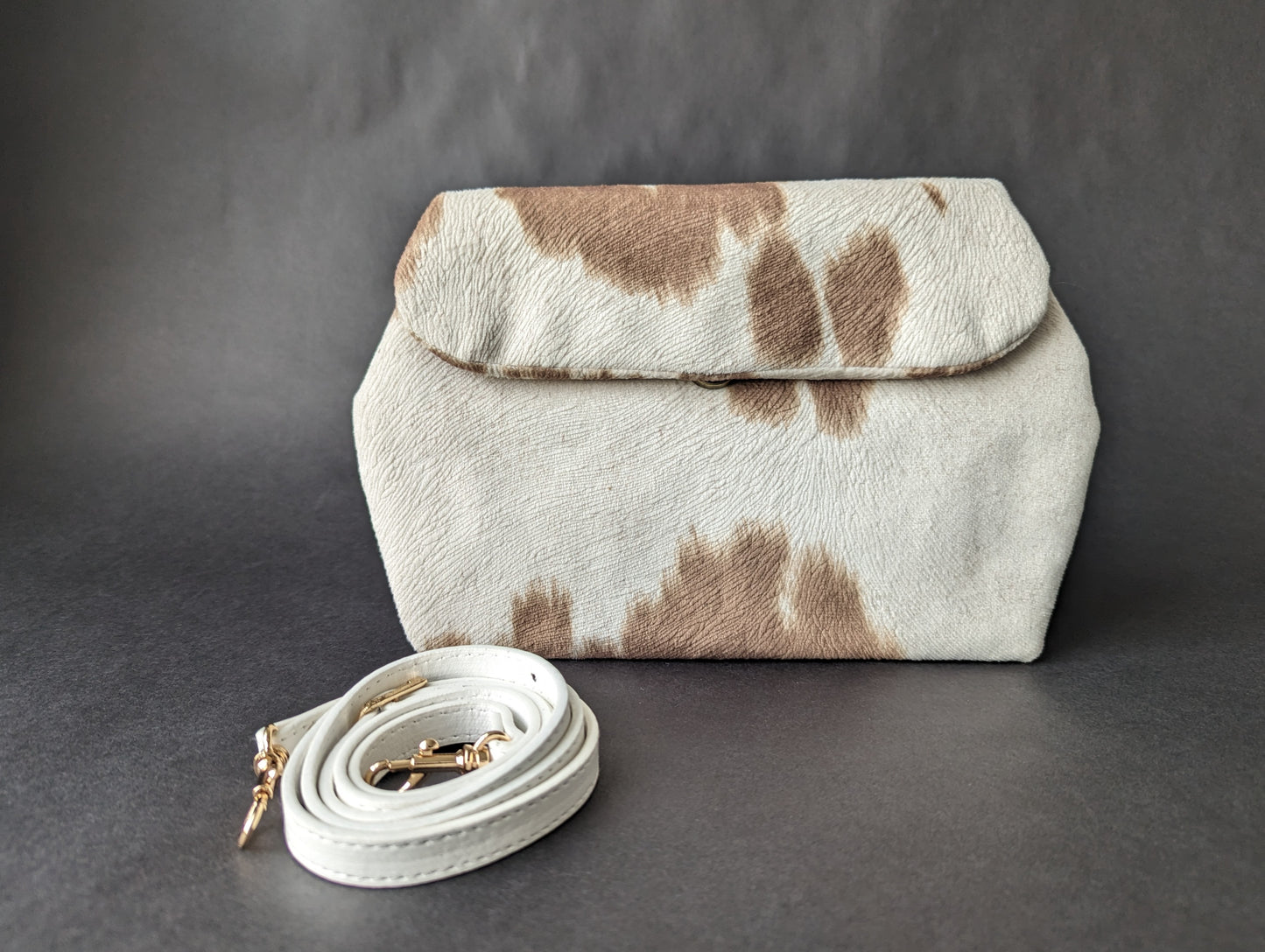 Muted Cow-Print Dileyas Belt Bag in Cream, Taupe